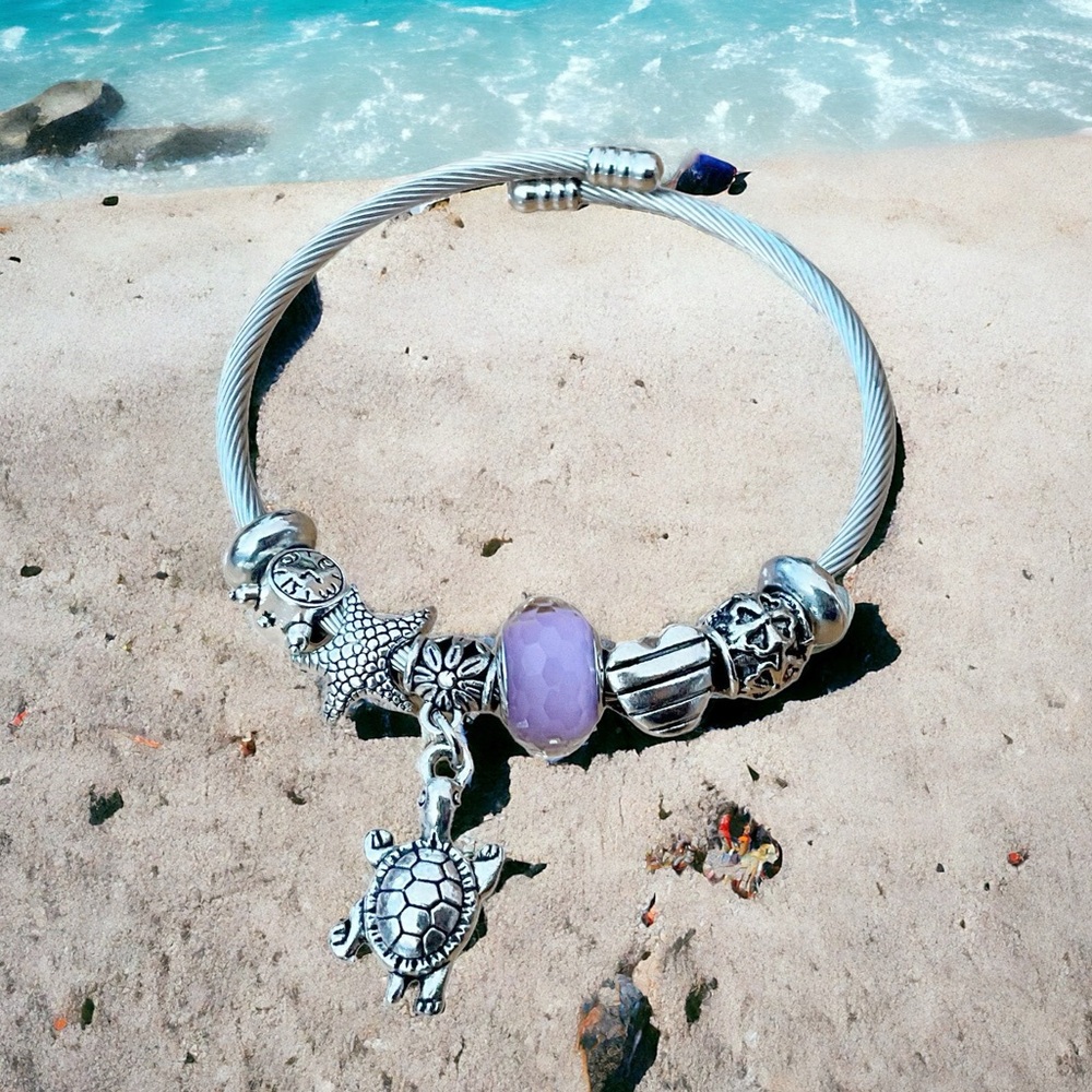 NWOT Turtle, Starfish, and Purple Silvertone Flexible Bead Bracelet